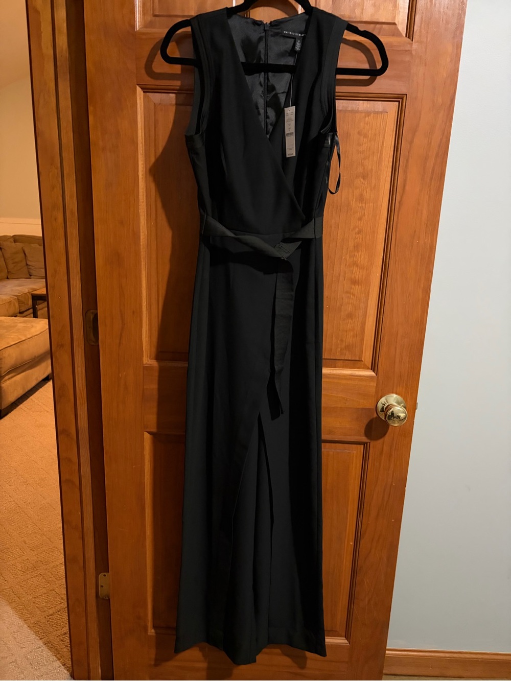 Brand New Elegant Black Sleeveless Wrap pant with belt. Zipper up back. Size 2